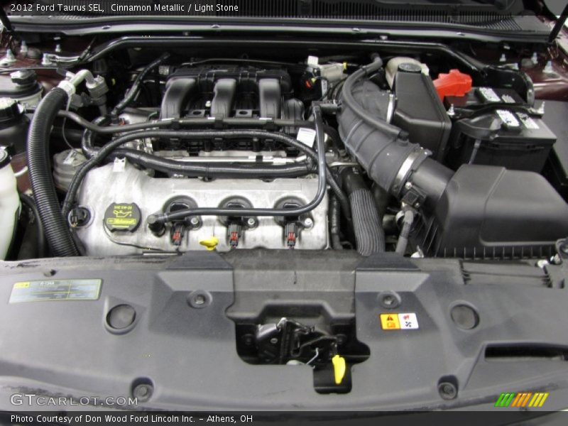 Cinnamon Metallic / Light Stone 2012 Ford Taurus SEL