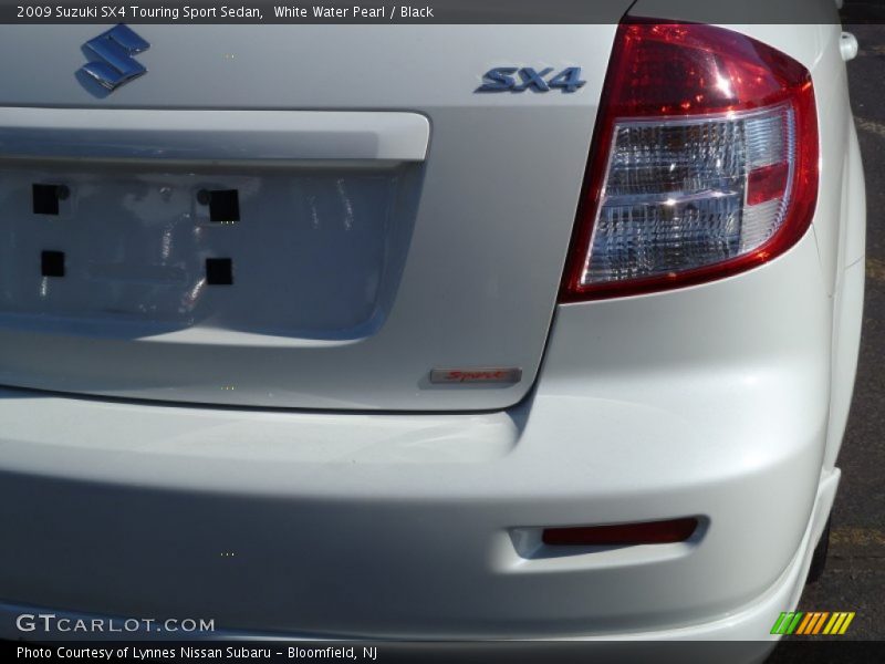 White Water Pearl / Black 2009 Suzuki SX4 Touring Sport Sedan