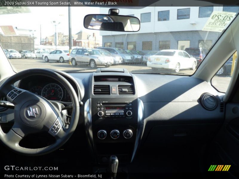 White Water Pearl / Black 2009 Suzuki SX4 Touring Sport Sedan