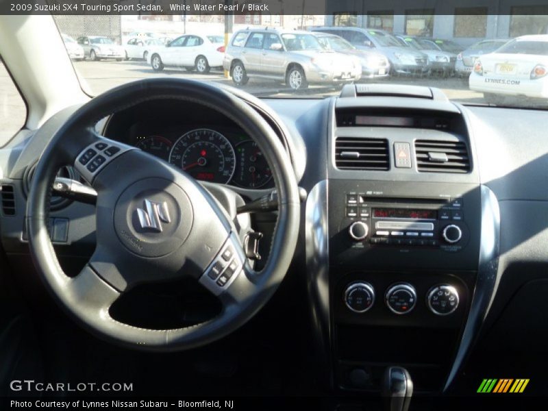 White Water Pearl / Black 2009 Suzuki SX4 Touring Sport Sedan