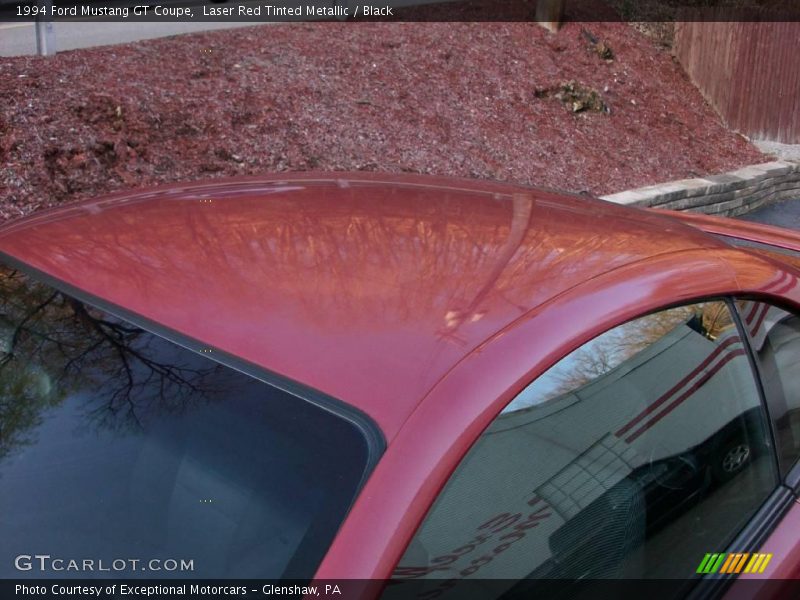 Laser Red Tinted Metallic / Black 1994 Ford Mustang GT Coupe