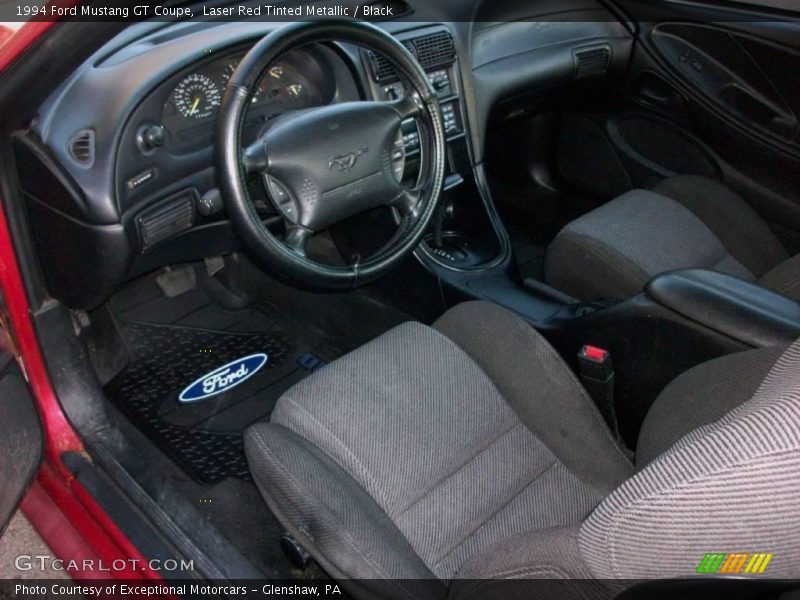 Laser Red Tinted Metallic / Black 1994 Ford Mustang GT Coupe