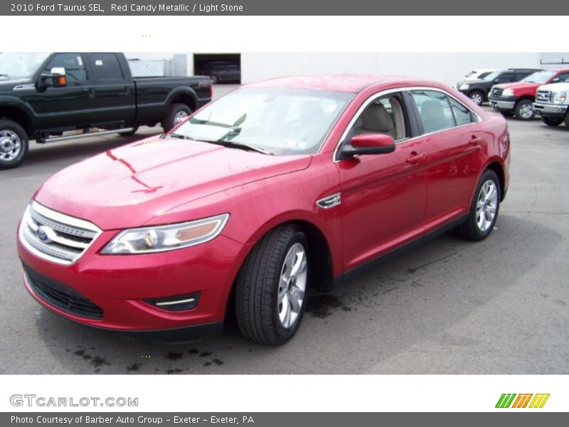 Red Candy Metallic / Light Stone 2010 Ford Taurus SEL
