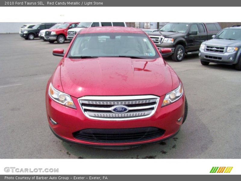 Red Candy Metallic / Light Stone 2010 Ford Taurus SEL