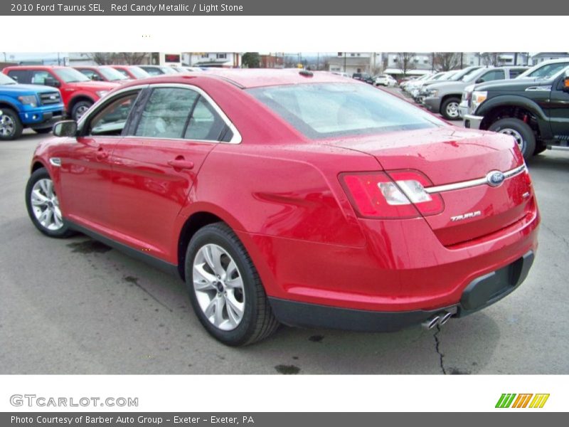 Red Candy Metallic / Light Stone 2010 Ford Taurus SEL