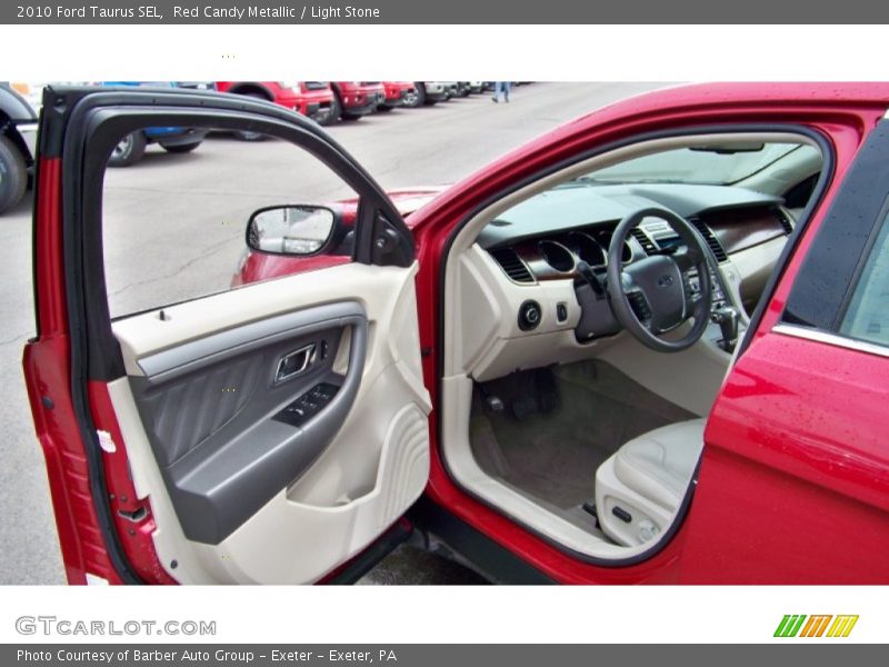 Red Candy Metallic / Light Stone 2010 Ford Taurus SEL