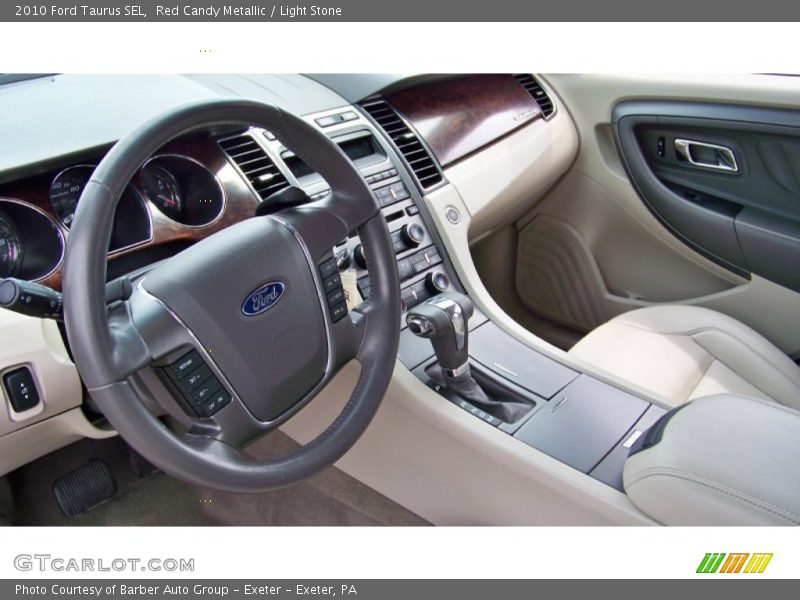 Red Candy Metallic / Light Stone 2010 Ford Taurus SEL