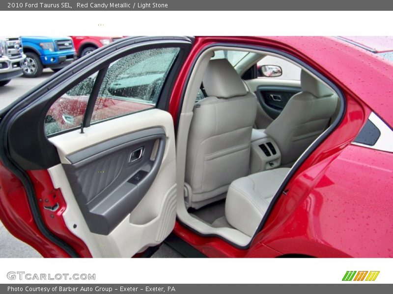 Red Candy Metallic / Light Stone 2010 Ford Taurus SEL