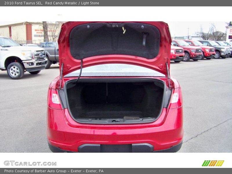 Red Candy Metallic / Light Stone 2010 Ford Taurus SEL