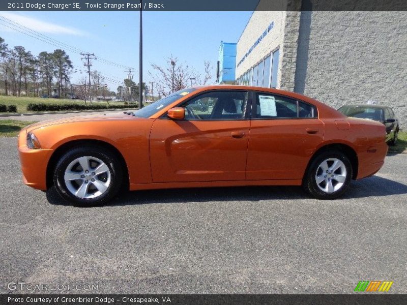 Toxic Orange Pearl / Black 2011 Dodge Charger SE