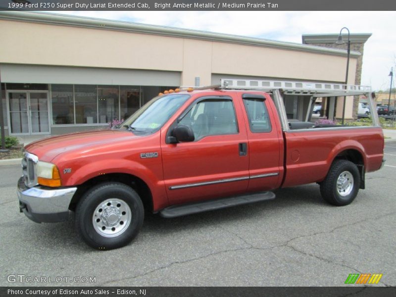 Bright Amber Metallic / Medium Prairie Tan 1999 Ford F250 Super Duty Lariat Extended Cab