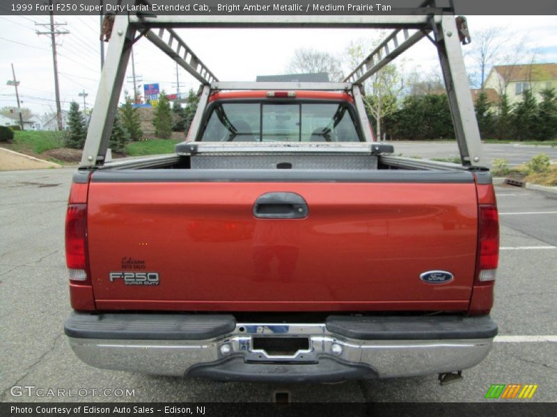 Bright Amber Metallic / Medium Prairie Tan 1999 Ford F250 Super Duty Lariat Extended Cab