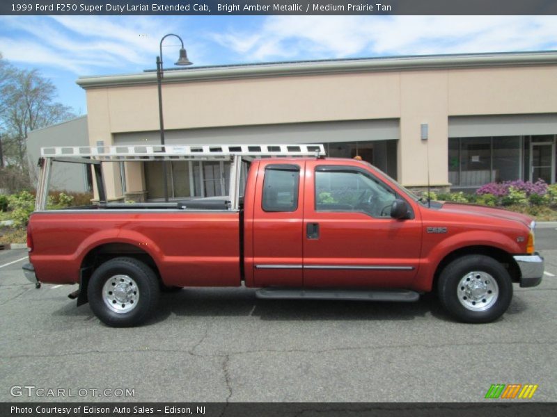 Bright Amber Metallic / Medium Prairie Tan 1999 Ford F250 Super Duty Lariat Extended Cab