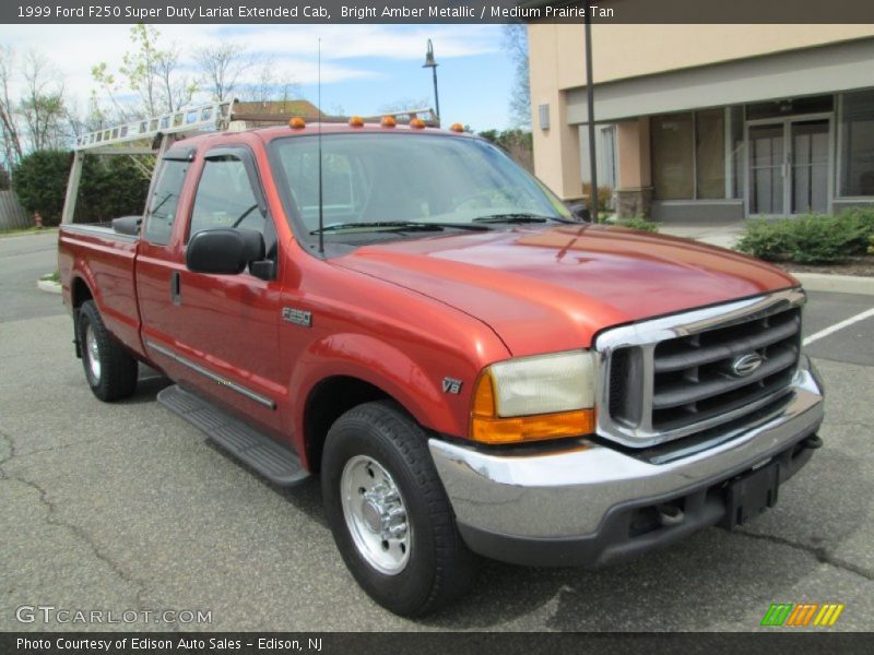Bright Amber Metallic / Medium Prairie Tan 1999 Ford F250 Super Duty Lariat Extended Cab