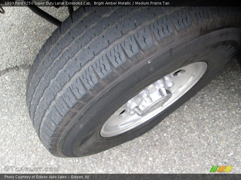 Bright Amber Metallic / Medium Prairie Tan 1999 Ford F250 Super Duty Lariat Extended Cab