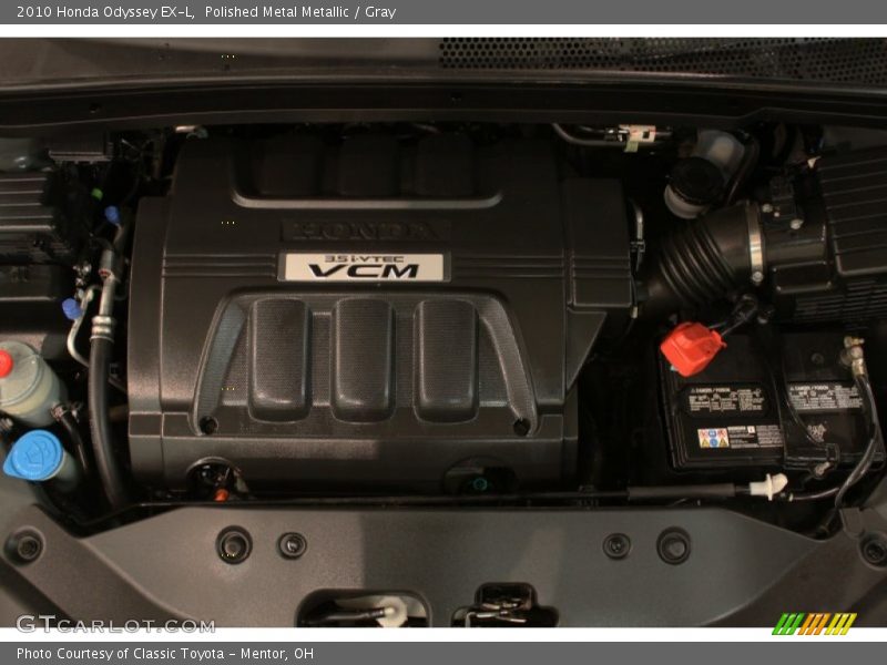 Polished Metal Metallic / Gray 2010 Honda Odyssey EX-L