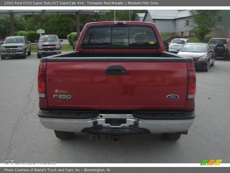 Toreador Red Metallic / Medium Flint Grey 2003 Ford F250 Super Duty XLT SuperCab 4x4