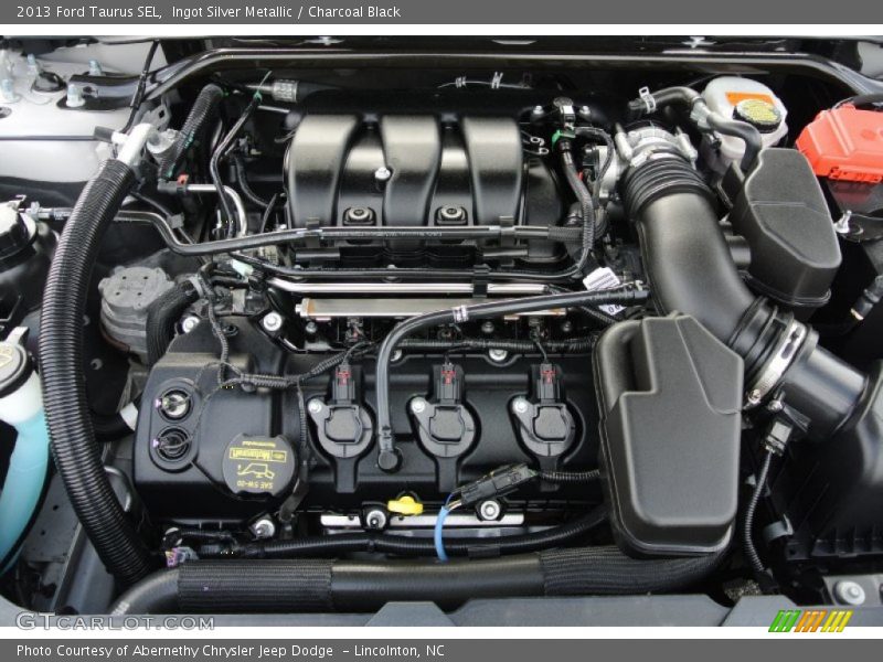 Ingot Silver Metallic / Charcoal Black 2013 Ford Taurus SEL