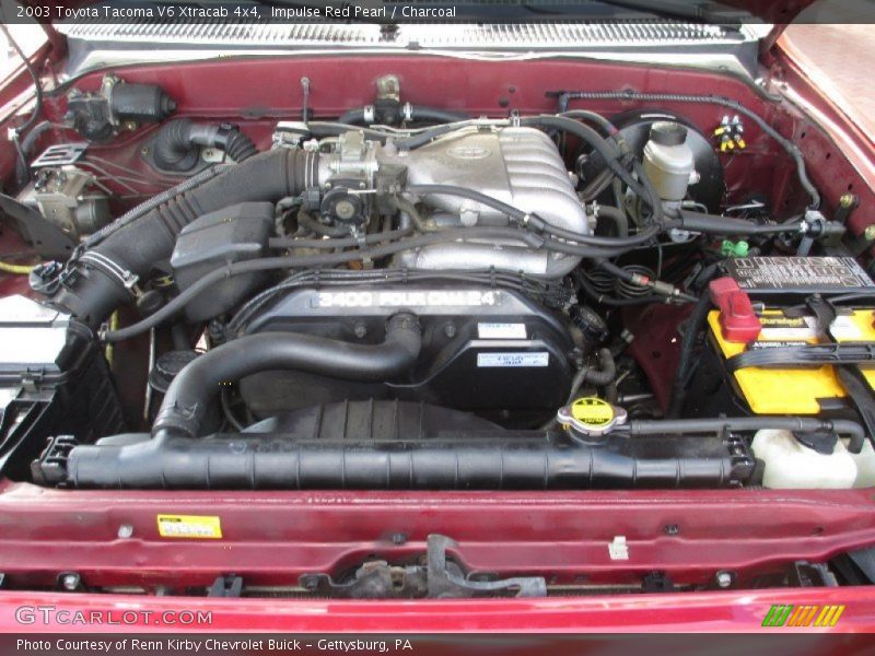 Impulse Red Pearl / Charcoal 2003 Toyota Tacoma V6 Xtracab 4x4