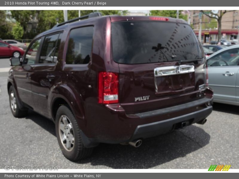 Dark Cherry Pearl / Beige 2010 Honda Pilot Touring 4WD