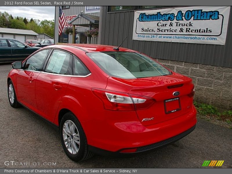 Race Red / Stone 2012 Ford Focus SEL Sedan