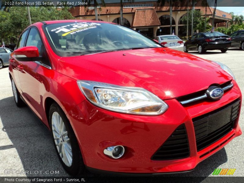 Race Red / Stone 2012 Ford Focus SEL Sedan