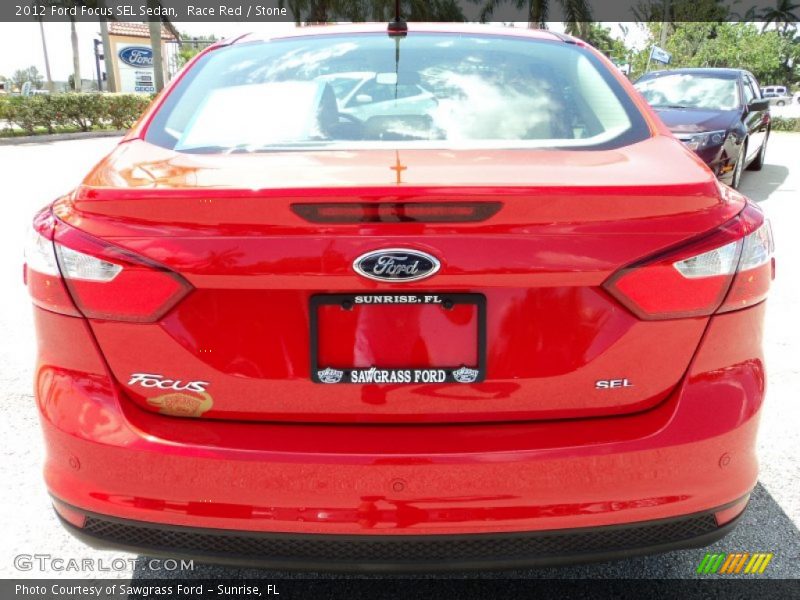 Race Red / Stone 2012 Ford Focus SEL Sedan