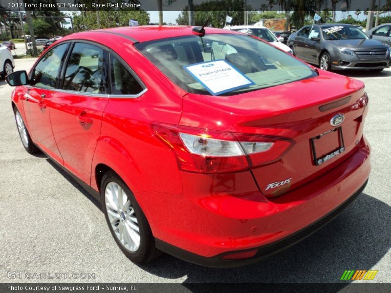 Race Red / Stone 2012 Ford Focus SEL Sedan