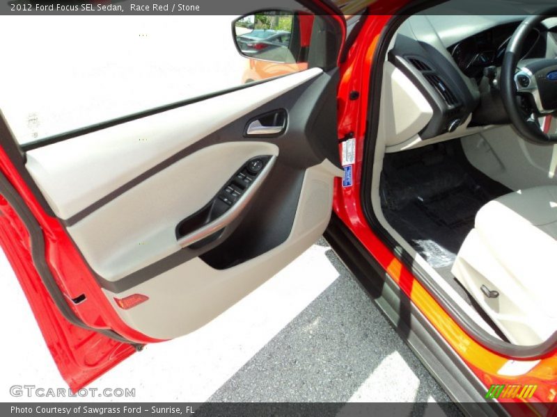 Race Red / Stone 2012 Ford Focus SEL Sedan