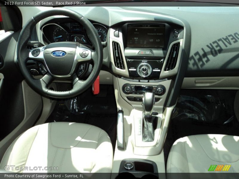 Race Red / Stone 2012 Ford Focus SEL Sedan