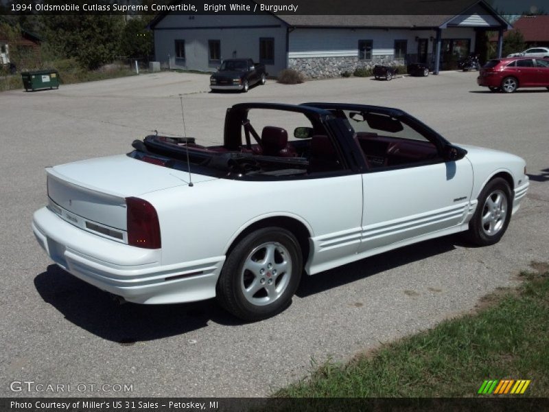Bright White / Burgundy 1994 Oldsmobile Cutlass Supreme Convertible