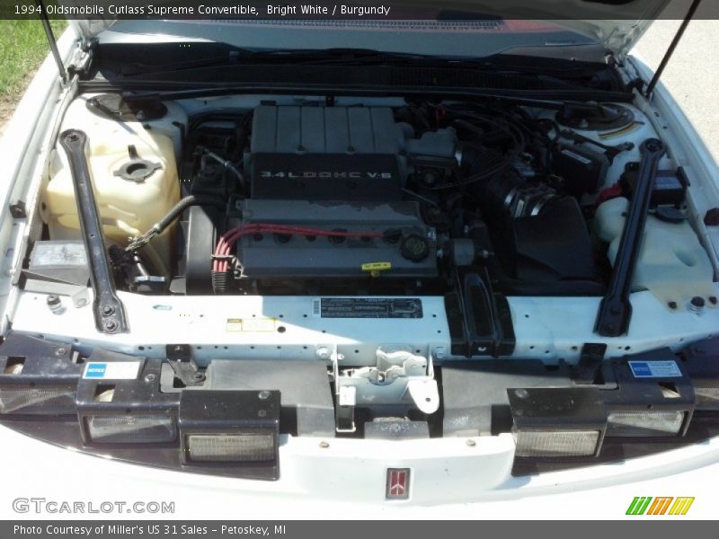 Bright White / Burgundy 1994 Oldsmobile Cutlass Supreme Convertible