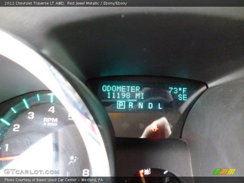 Red Jewel Metallic / Ebony/Ebony 2011 Chevrolet Traverse LT AWD
