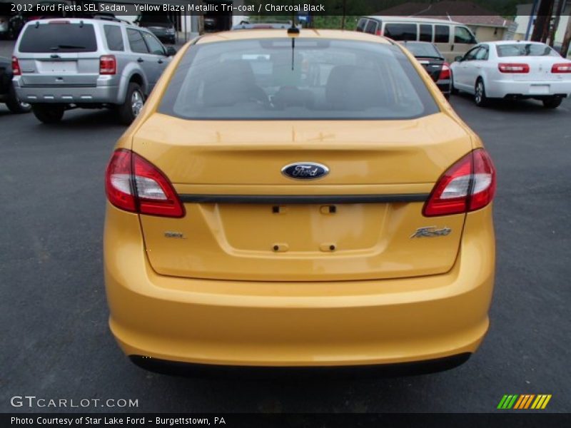 Yellow Blaze Metallic Tri-coat / Charcoal Black 2012 Ford Fiesta SEL Sedan