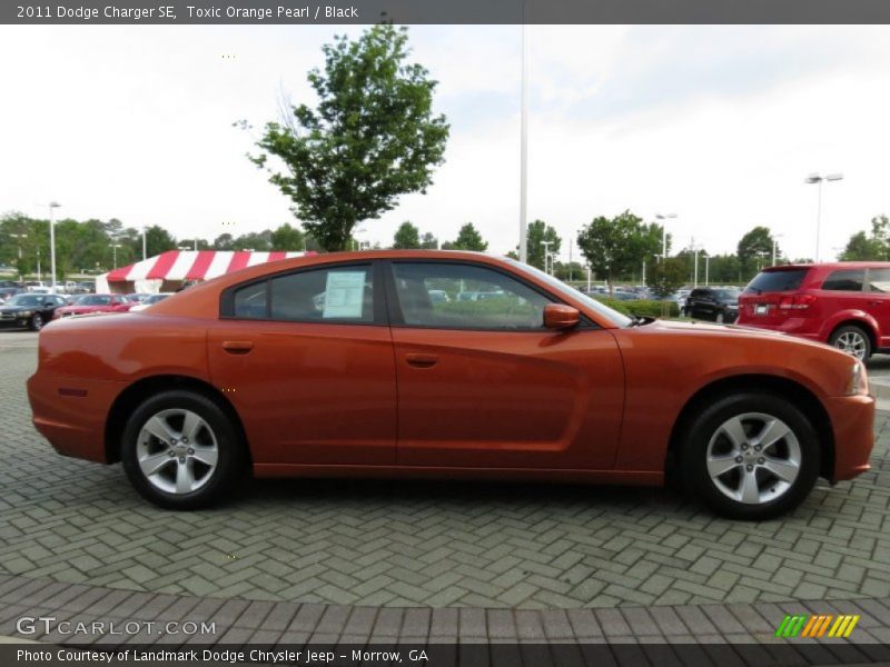 Toxic Orange Pearl / Black 2011 Dodge Charger SE