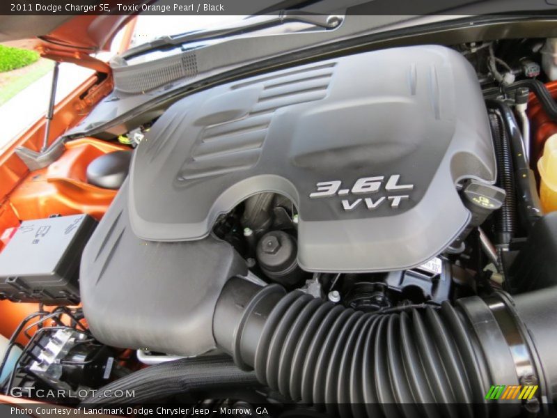 Toxic Orange Pearl / Black 2011 Dodge Charger SE