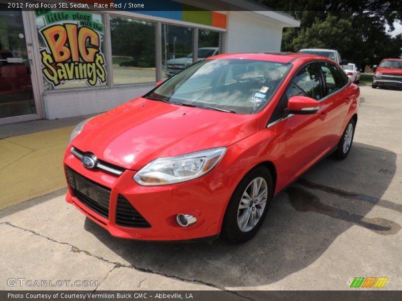 Race Red / Stone 2012 Ford Focus SEL Sedan