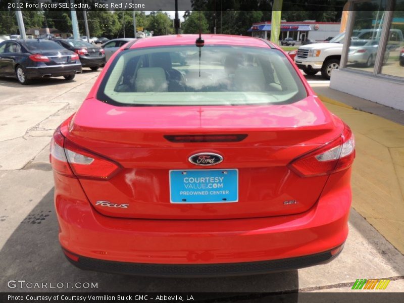 Race Red / Stone 2012 Ford Focus SEL Sedan