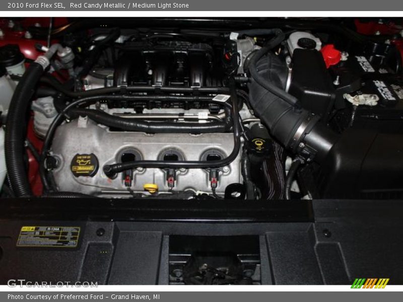Red Candy Metallic / Medium Light Stone 2010 Ford Flex SEL