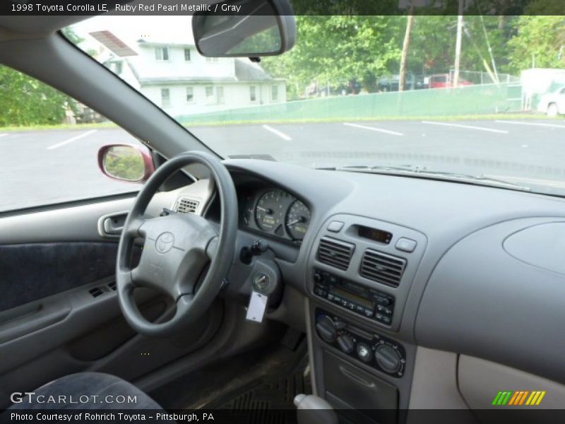 Ruby Red Pearl Metallic / Gray 1998 Toyota Corolla LE