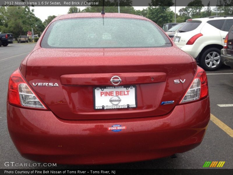 Red Brick / Charcoal 2012 Nissan Versa 1.6 SV Sedan
