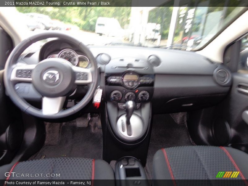 Crystal White Pearl / Black 2011 Mazda MAZDA2 Touring