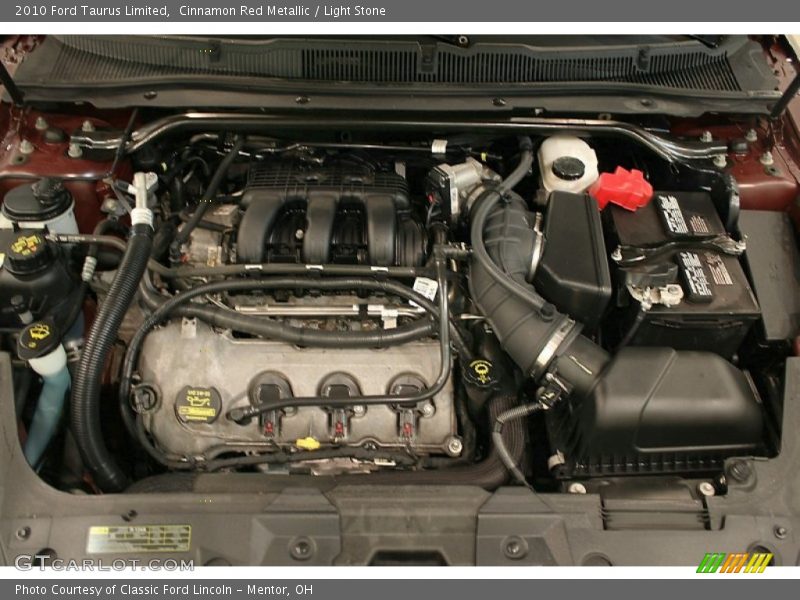 Cinnamon Red Metallic / Light Stone 2010 Ford Taurus Limited