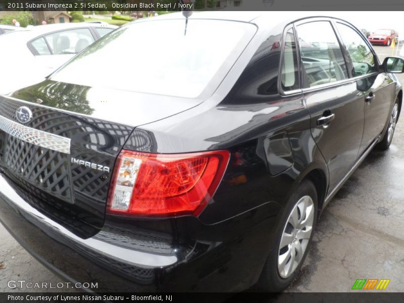 Obsidian Black Pearl / Ivory 2011 Subaru Impreza 2.5i Sedan