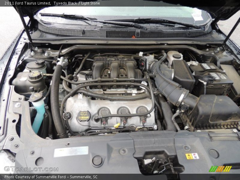 Tuxedo Black / Light Stone 2011 Ford Taurus Limited