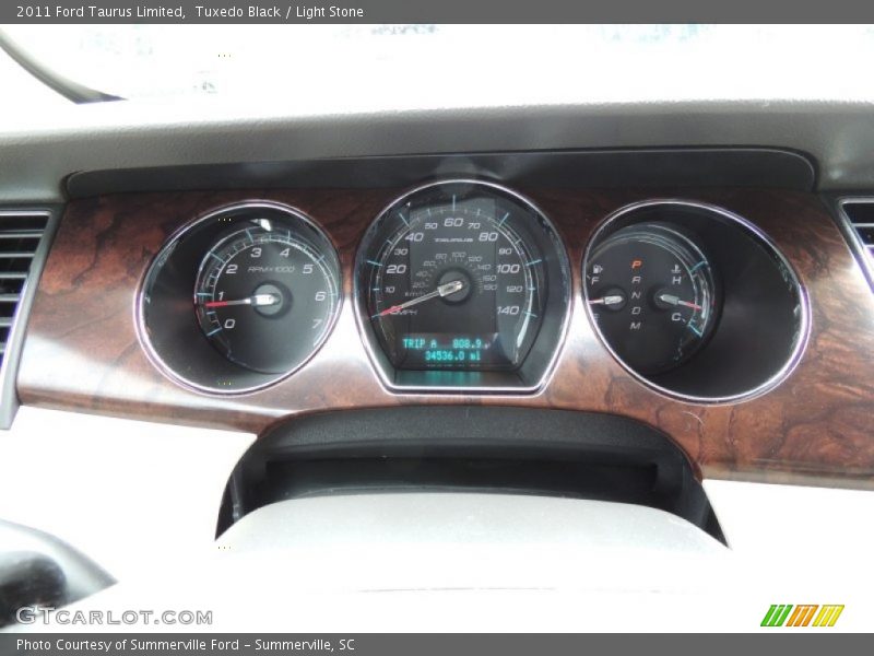 Tuxedo Black / Light Stone 2011 Ford Taurus Limited