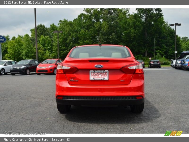 Race Red / Stone 2012 Ford Focus SEL Sedan