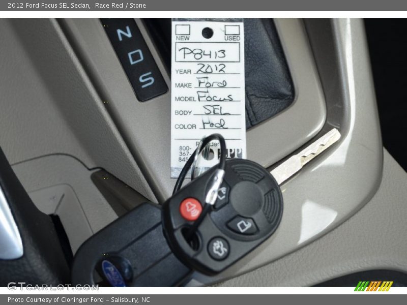 Race Red / Stone 2012 Ford Focus SEL Sedan
