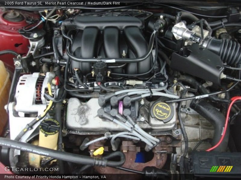 Merlot Pearl Clearcoat / Medium/Dark Flint 2005 Ford Taurus SE