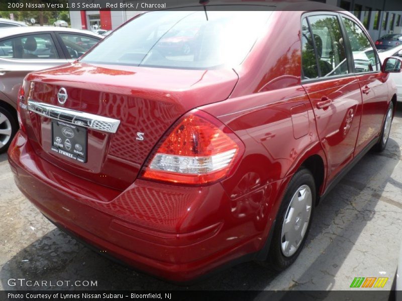 Red Brick / Charcoal 2009 Nissan Versa 1.8 S Sedan